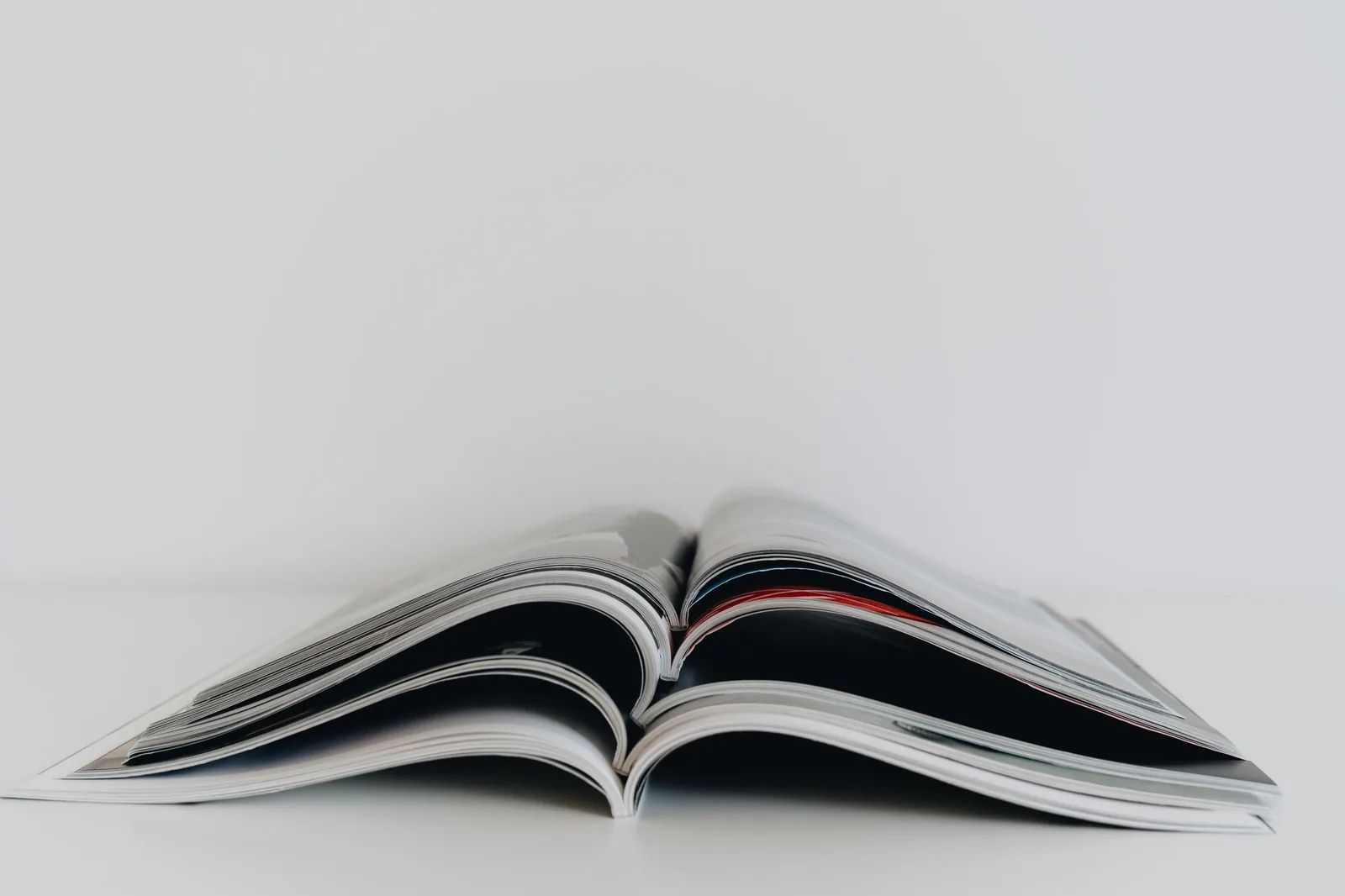 A stack of open magazines
