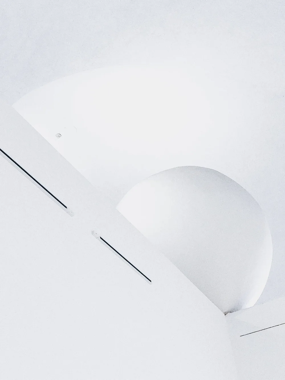 Soft geometric shapes on a white ceiling