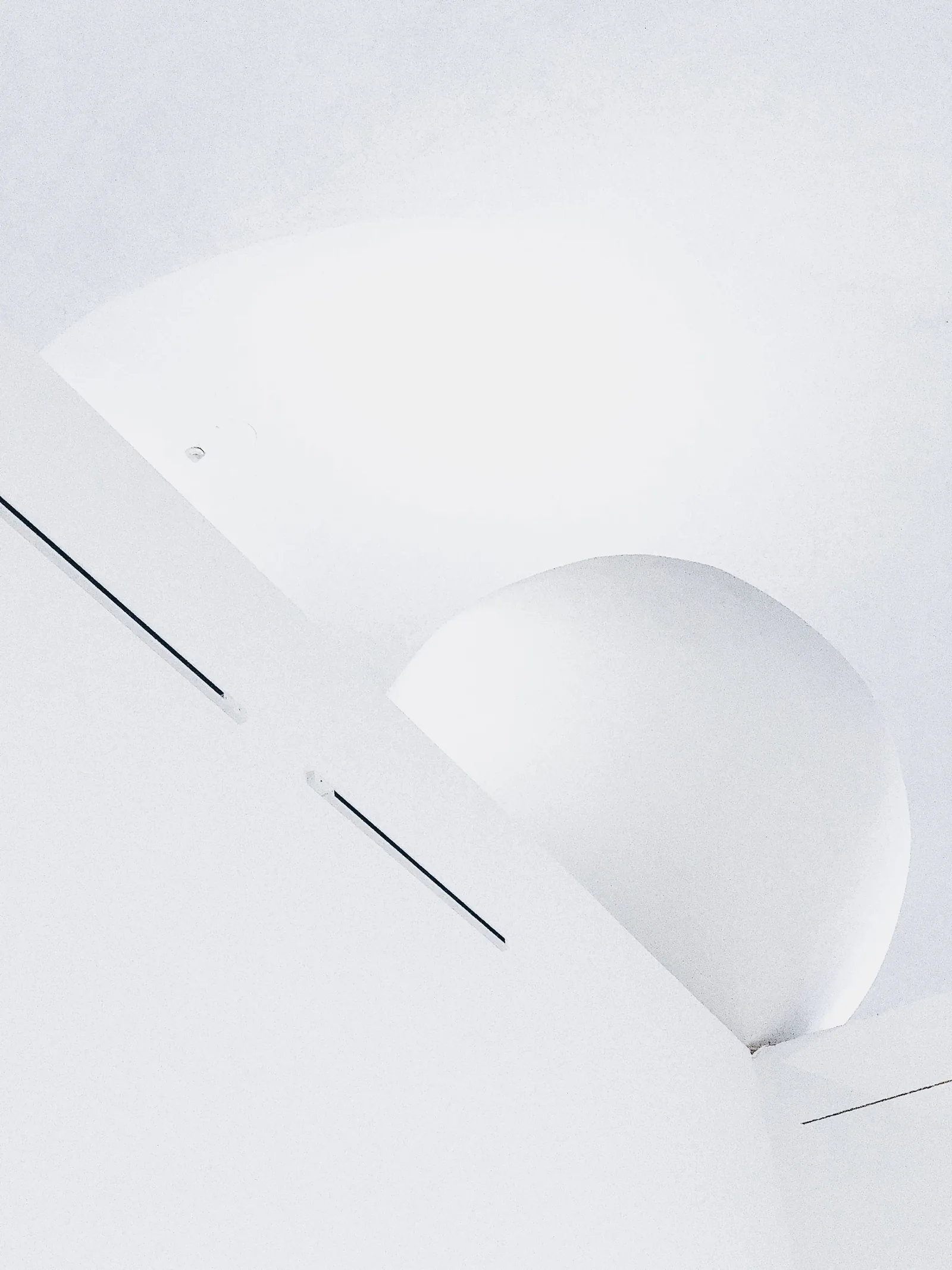 Soft geometric shapes on a white ceiling